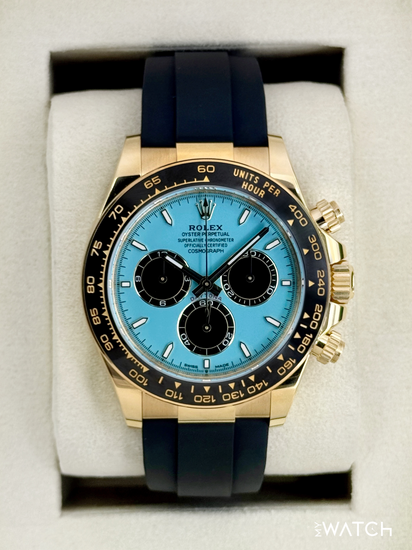 Relógio Rolex Daytona automático em ouro e pulseira azul, mostrador azul com cronógrafo.