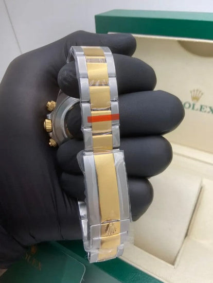 Relógio Rolex Daytona bicolor aço e ouro, laterais douradas e mostrador verde