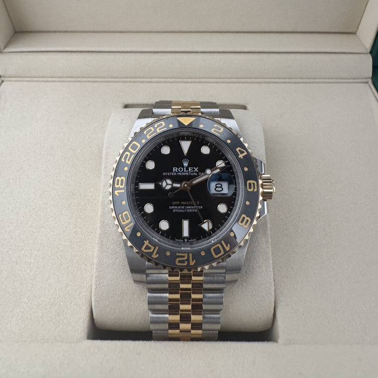 Relógio Rolex em caixa aço e dourado, mostrador preto com data 27